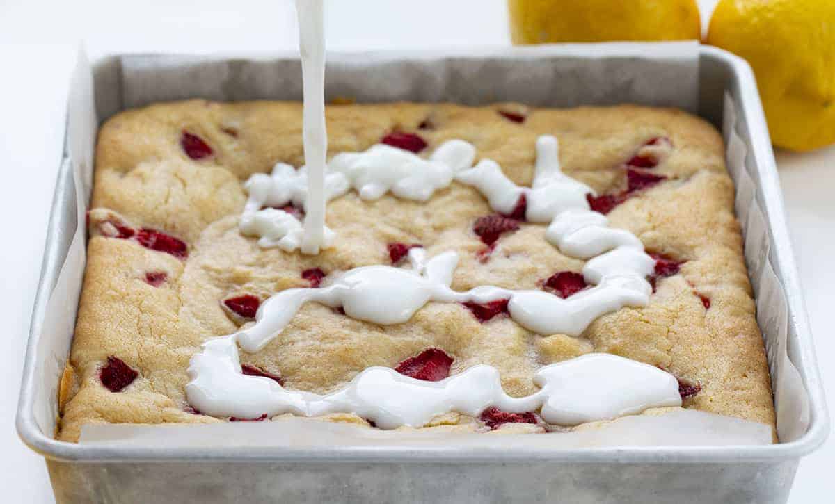 Pouring Glaze on Strawberry Lemon Blondies