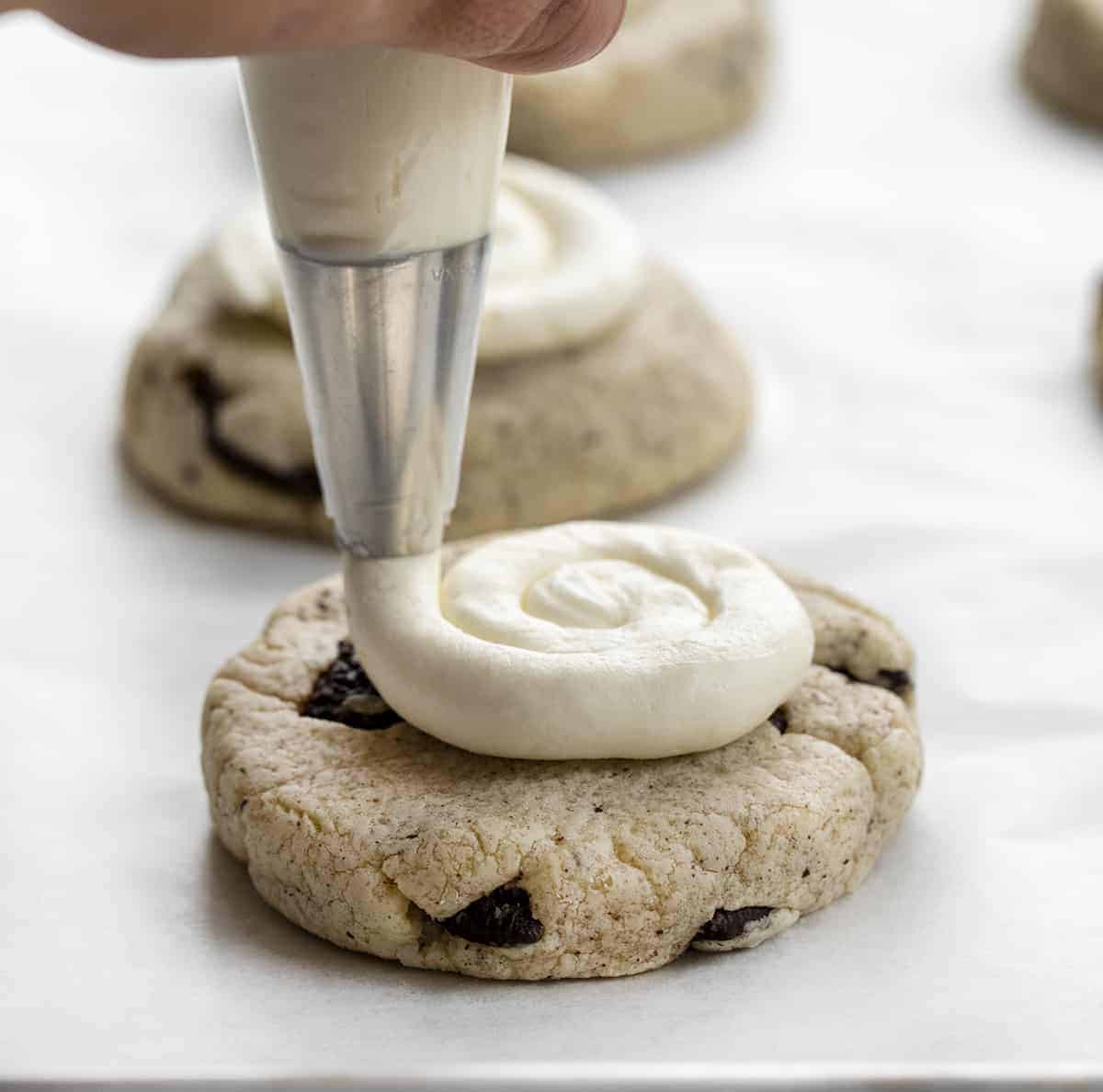 Adding Frosting to Copycat Crumbl Cookies & Cream Cookie
