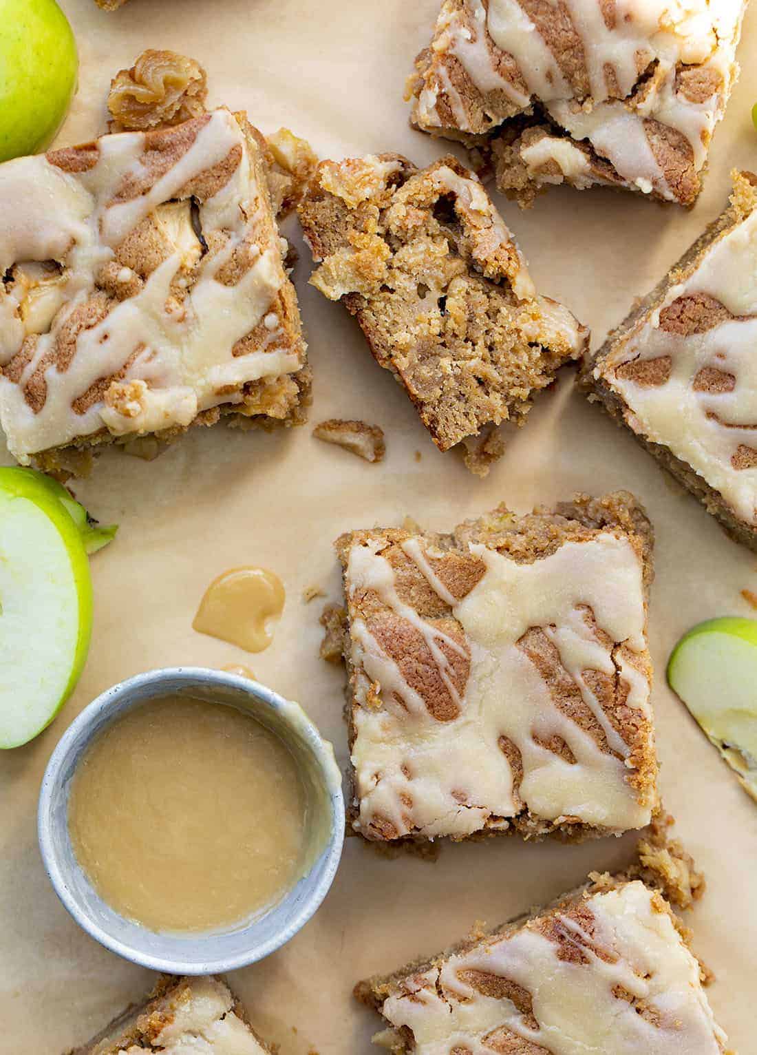 Cut up Apple Blondies with ramekin of Maple Glaze