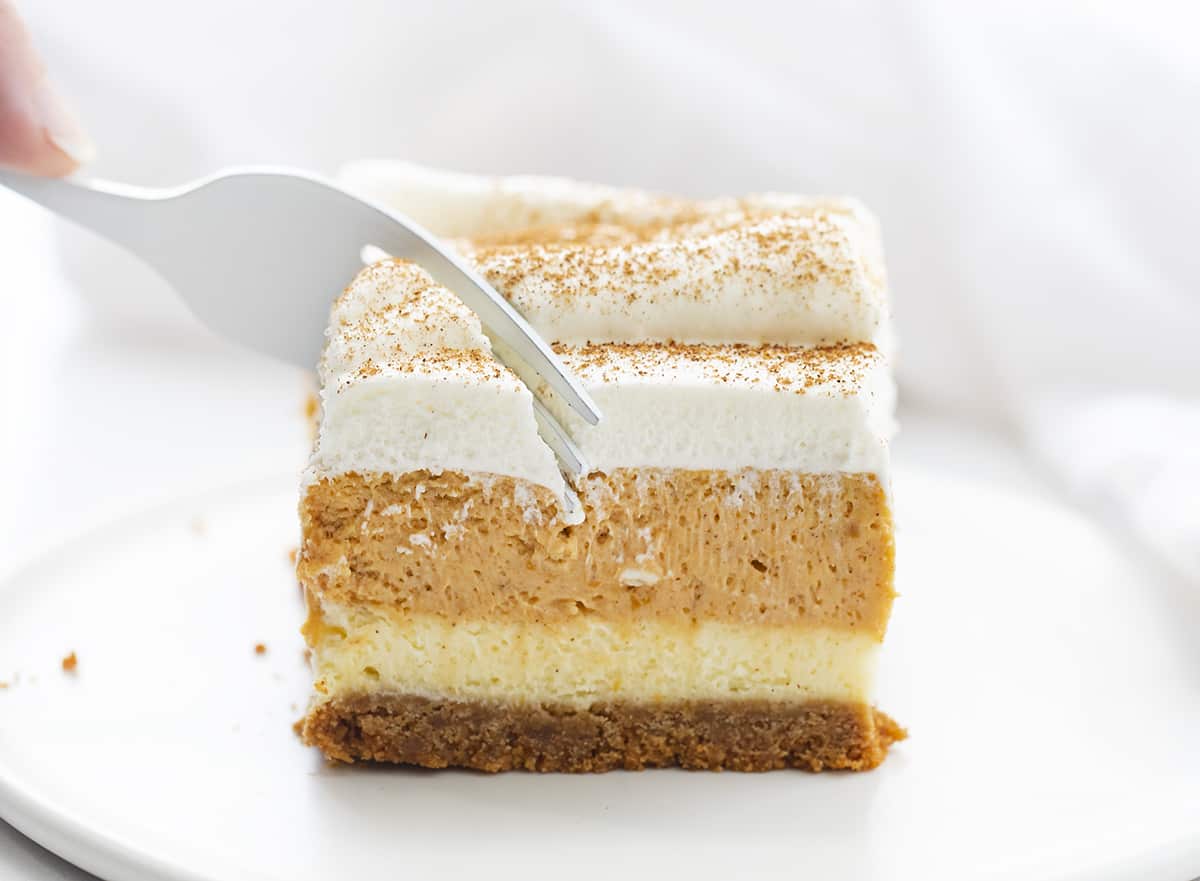 Fork Taking Bite out of Pumpkin Cheesecake Bars