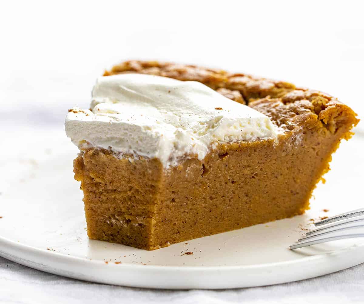 Piece of Impossible Pumpkin Pie with Bite Taken Out