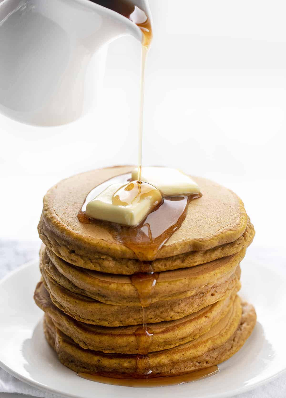 Pouring Syrup over Pumpkin Pancake