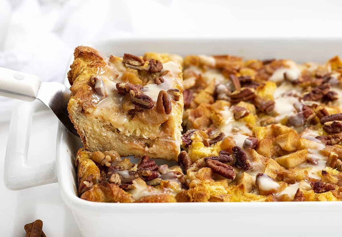 Removing a Piece of Overnight Apple French Toast Bake from Casserole Pan