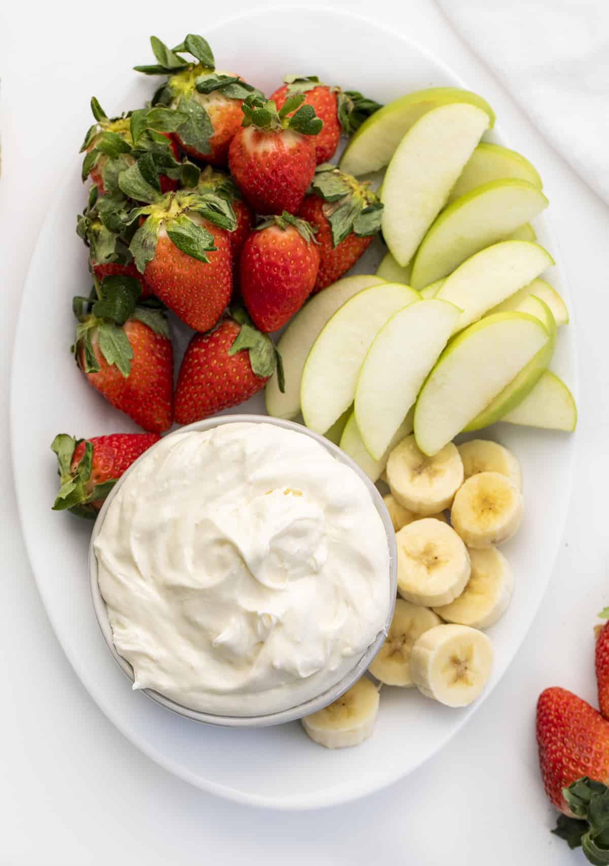 Plate of Easy Fruit Dip with Apples, Bananas, and Strawberries.