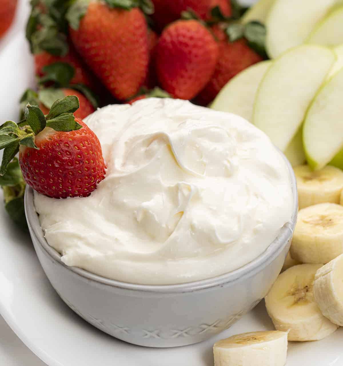 Bowl of Easy Fruit Dip with a Strawberry