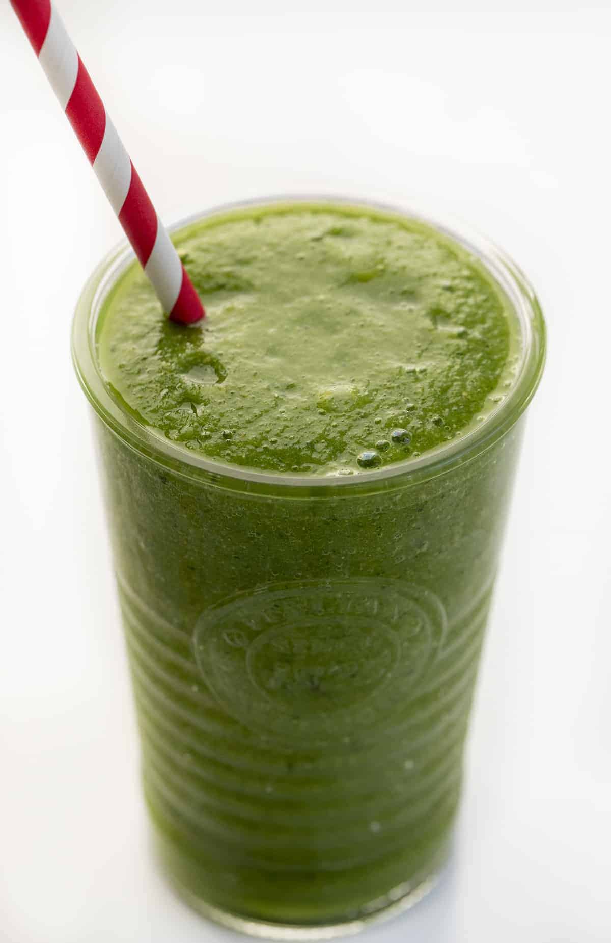 Glass of Green Smoothie with Straw