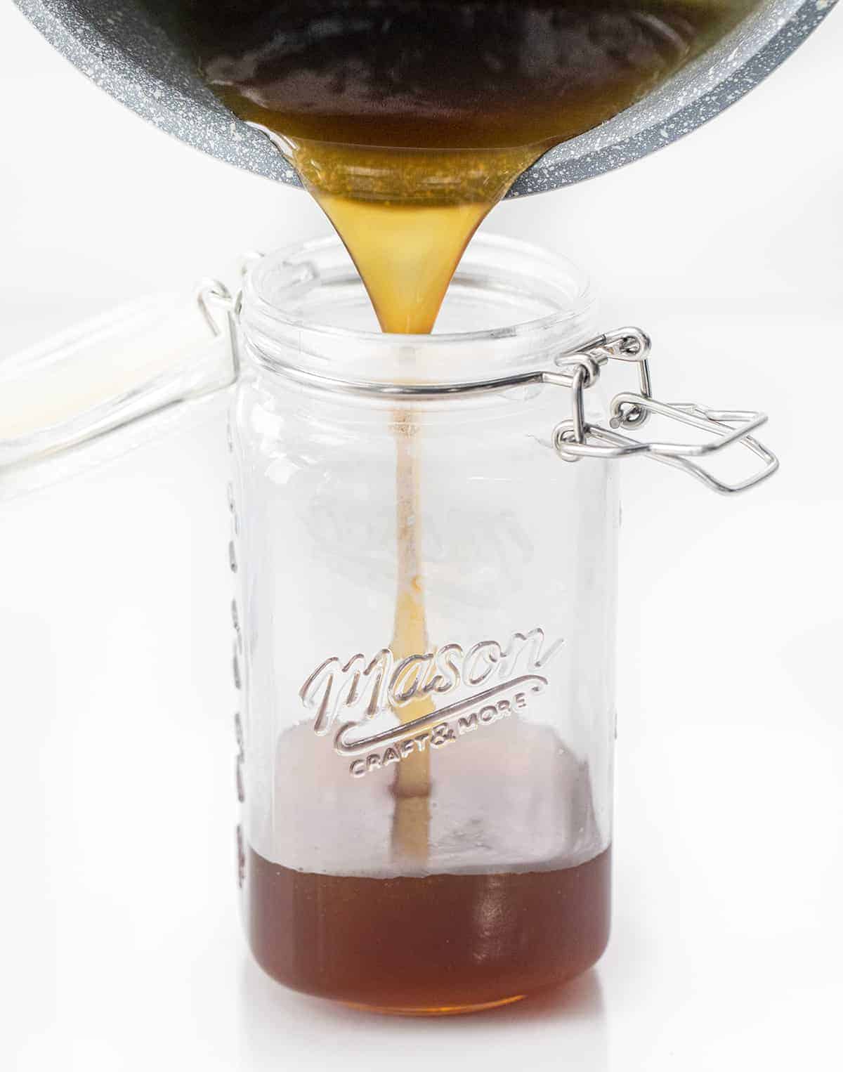 Pouring Sugar Cookie Syrup into Jar