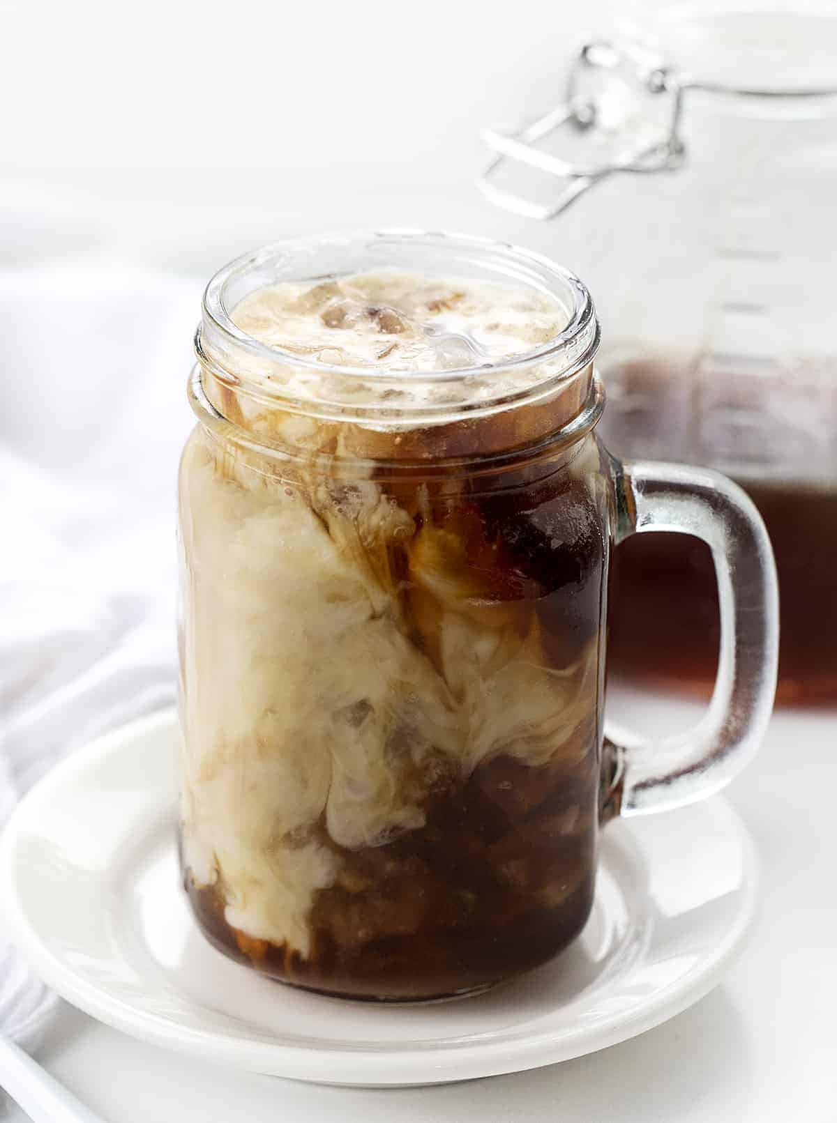 Unstirred Iced Sugar Cookie Latte in a Mug