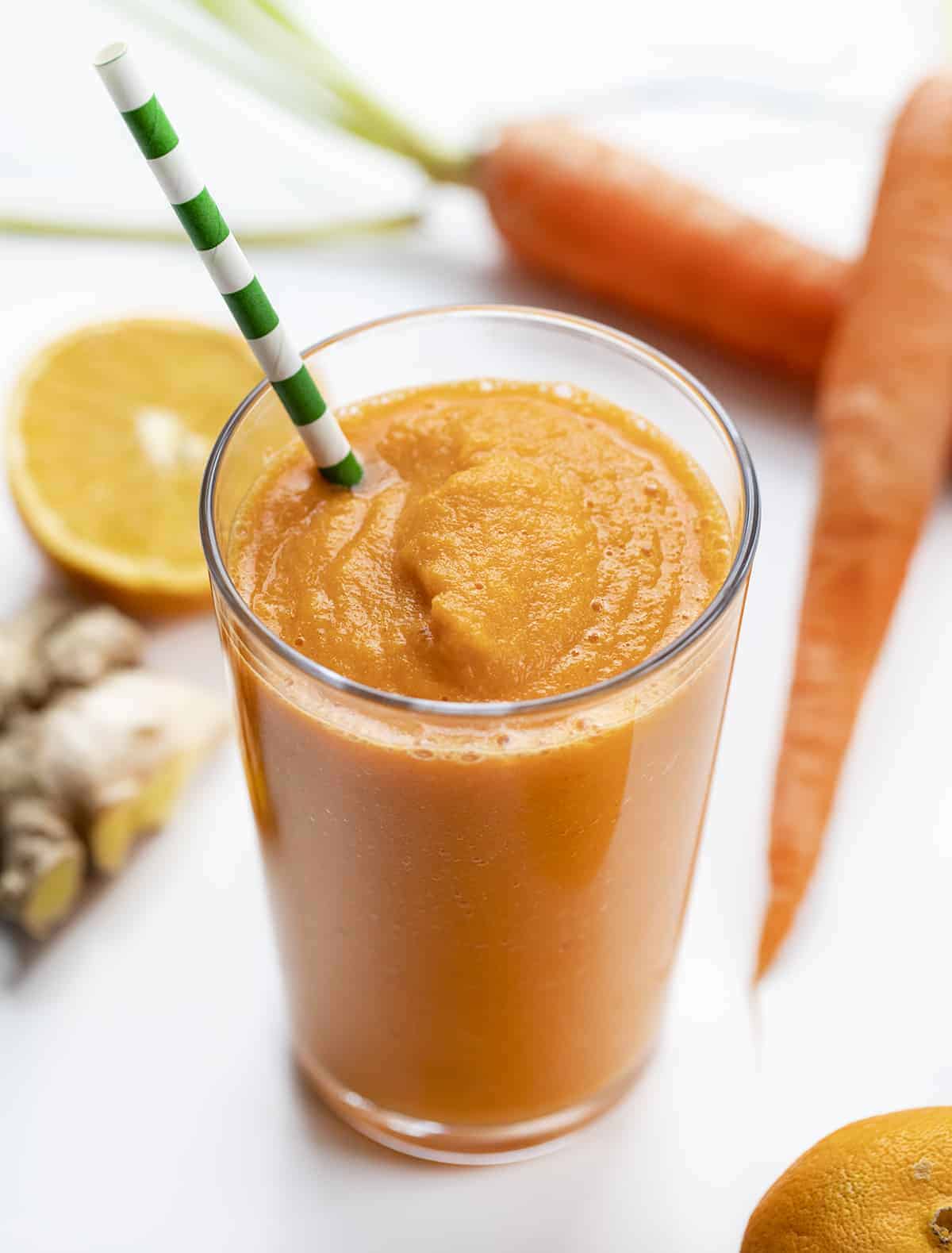 Glass of Orange Smoothie with Straw