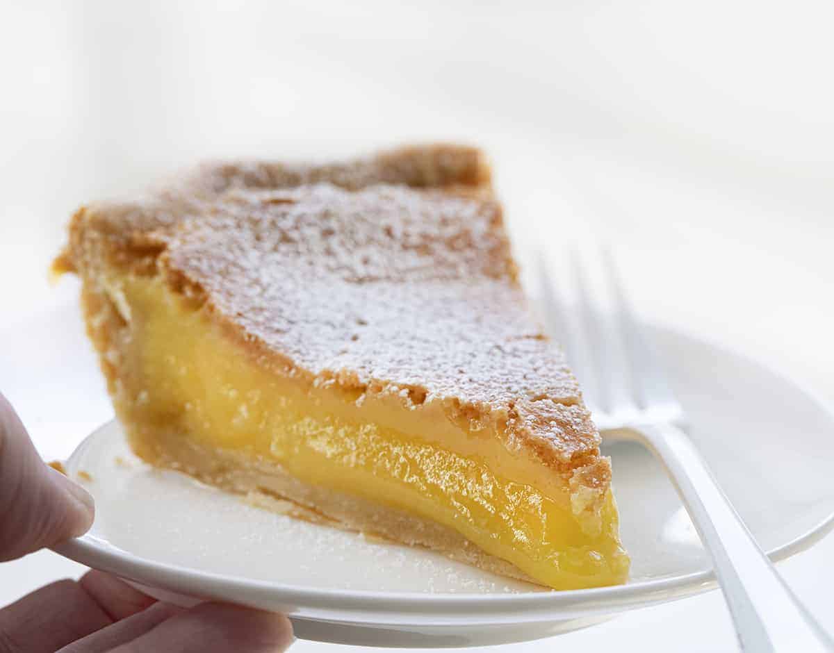 Piece of Chess Pie Recipe on a White Plate with a White Fork