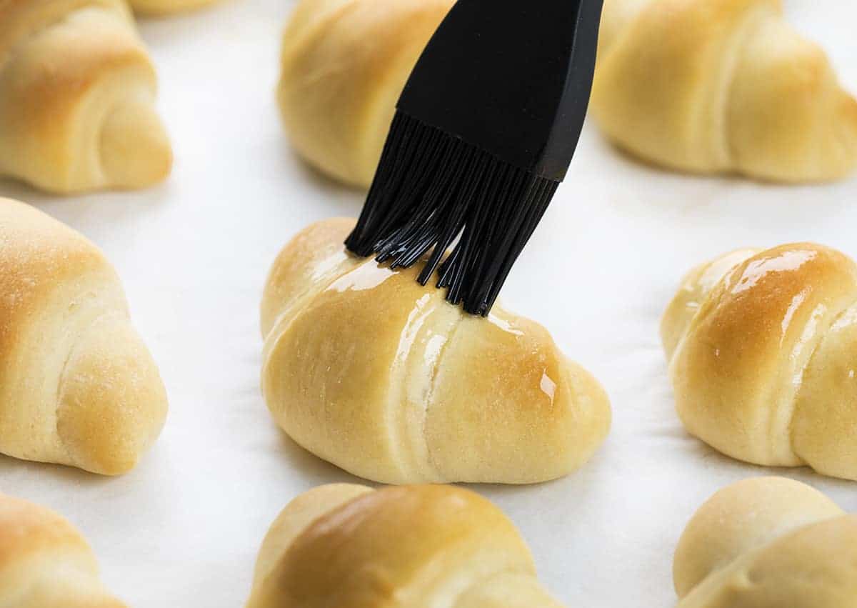 Brushing Butter onto Homemade Crescent Rolls Recipe