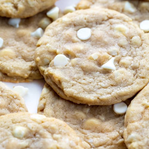 White Chocolate Macadamia Nut Cookies on a White Counter.