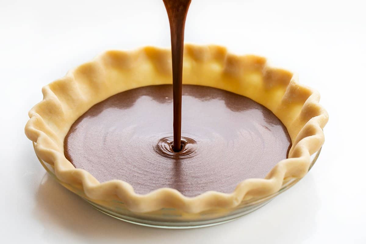 Pouring Chocolate Cheese Pie Batter into a Pie Crust