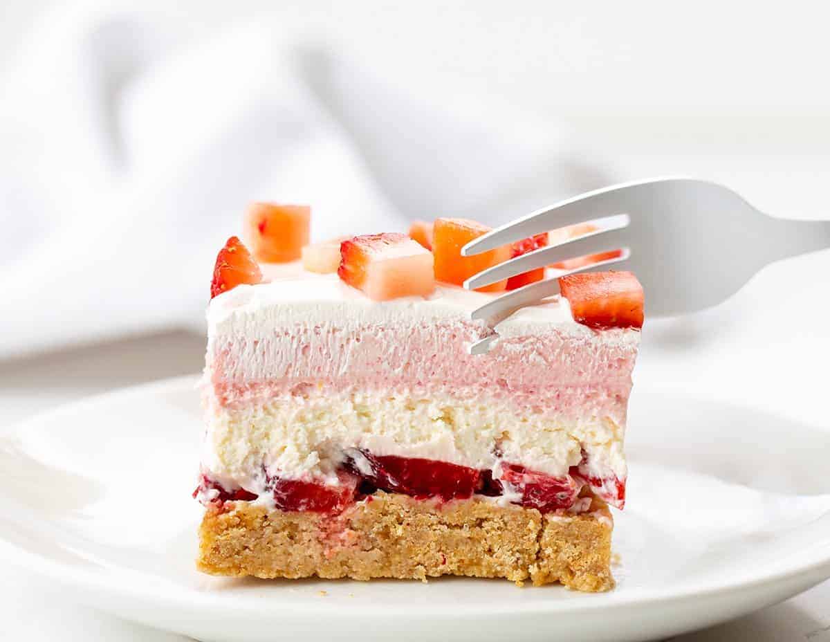 Fork Taking a Bite of No Bake Strawberry Delight