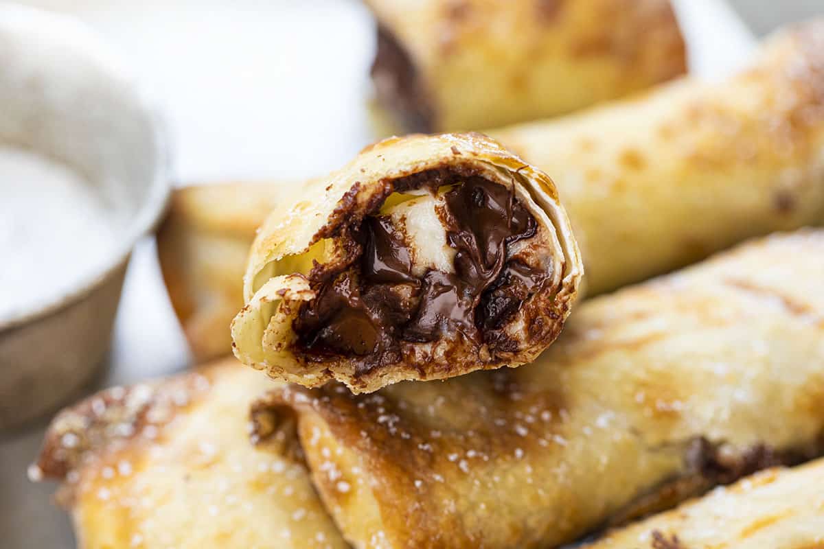 Cut Into Chocolate Chip Cheesecake Egg Rolls. Dessert, Air Fryer Dessert, Frying Dessert, Baked Dessert, Chocolate Chip Cheesecake, Egg Rolls, Snacks, Air Fryer Recipes, Cheesecake, Chocolate, i am baker, iambaker