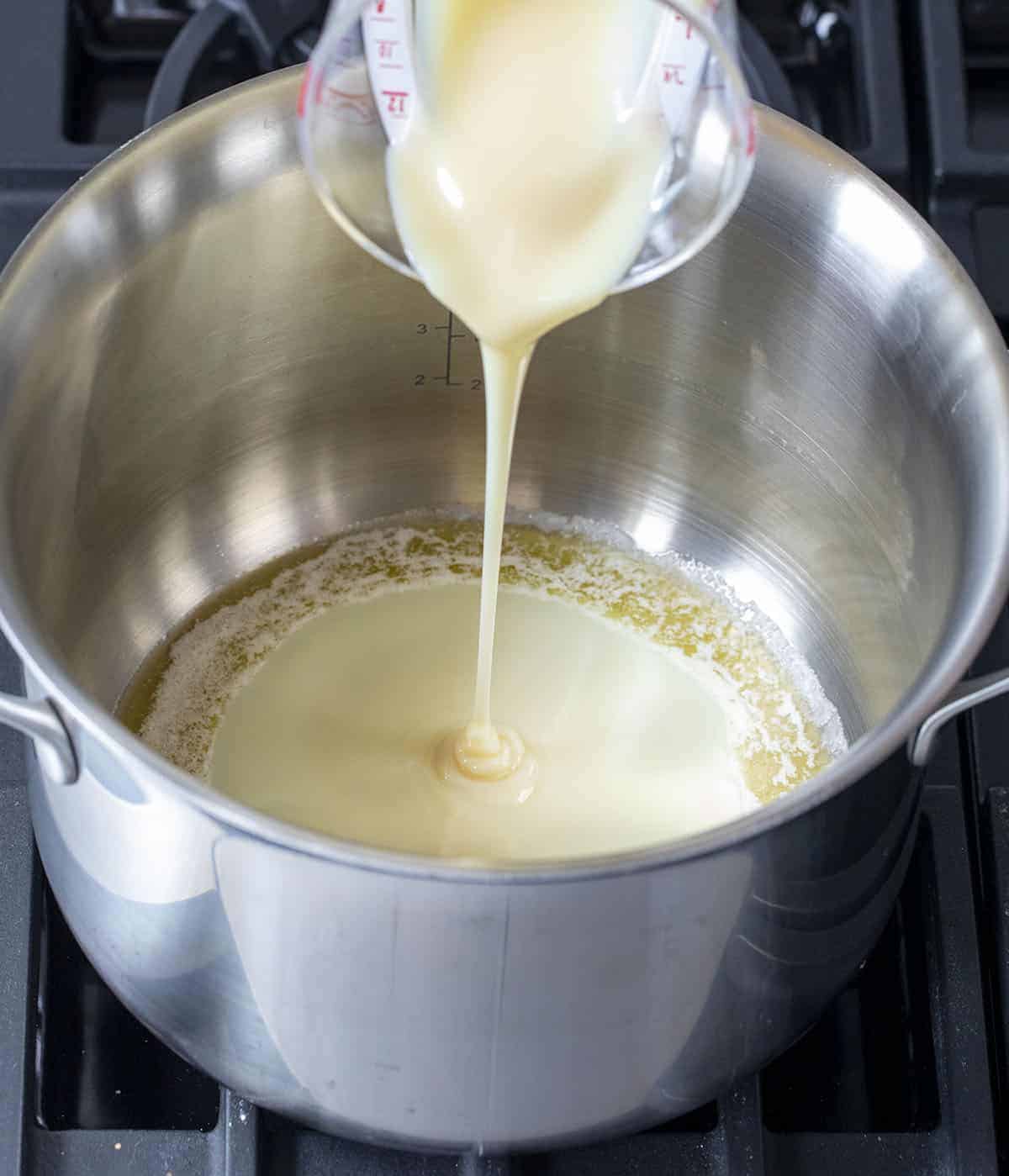 Adding Sweetened Condensed Milk to Pot to Make Soft Rice Krispie Bars - Viral TikTok Rice Krispy Bars