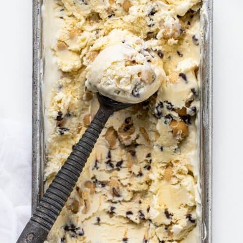 Ice Cream Scoop with Bowls of No Churn Cookie Dough Ice Cream in It in Pan