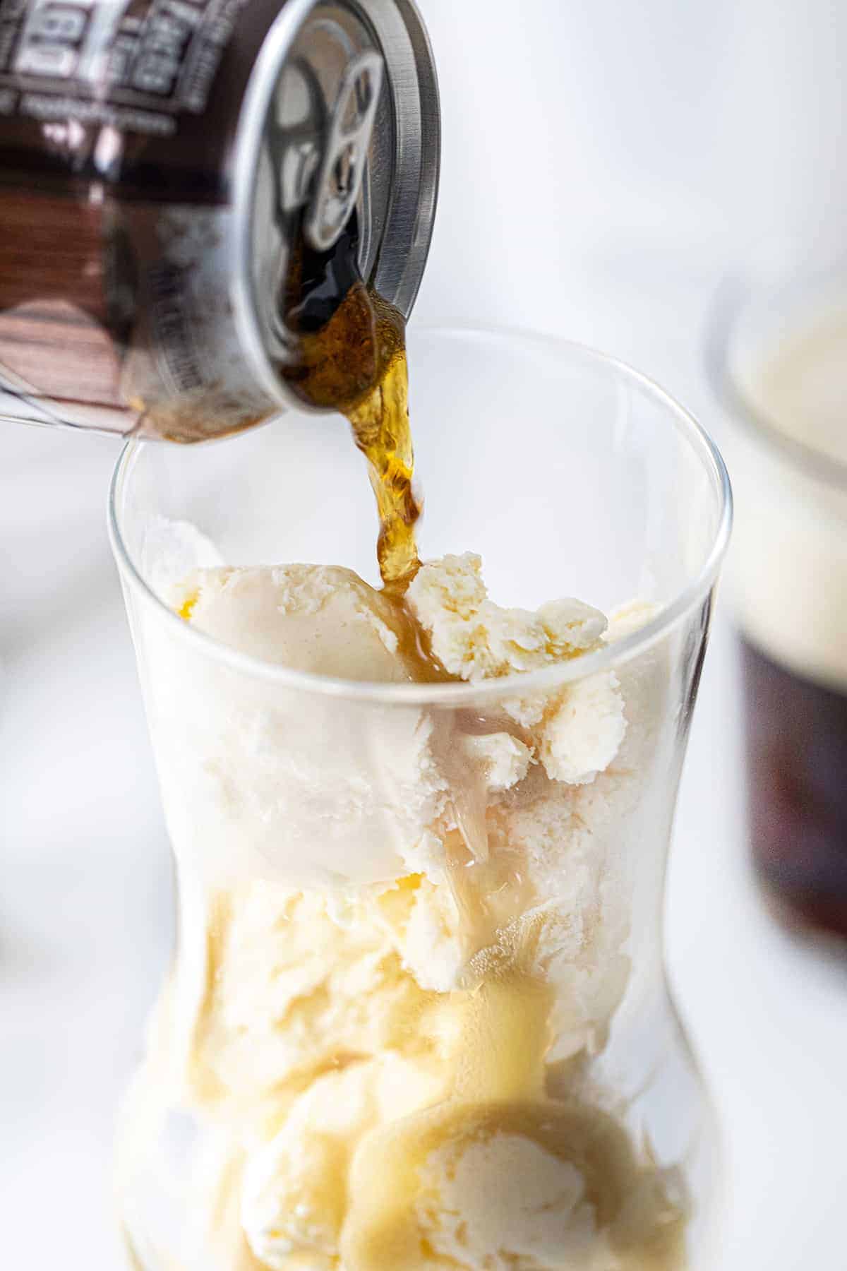 Pouring Root Beer Into Glass Filled with Ice Cream to Make Dirty Root Beer Float - RumChata Root Beer Float.