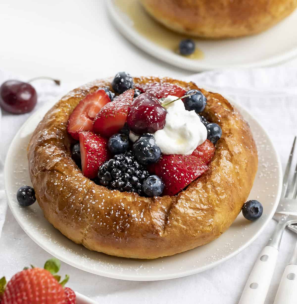 French Toast Bread Bowl on a Plate Filled with Fruit and Sprinkled with Confectioners Sugar. reakfast, French Toast, French Toast Bread Bowl, Fresh Fruit French Toast Bread Bowl, How to Make a Bread Bowl into French Toast, What Bread for French Toast, Fruit Filled French Toast, Fruit Breakfast, Breakfast Recipes, Decadent Breakfast, Brunch Breakfast Ideas, i am baker, iambaker.