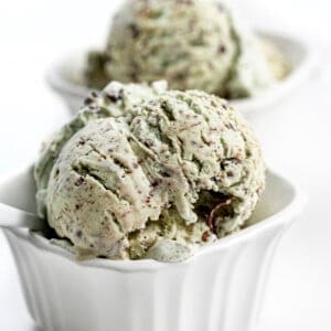 Two Bowls No-Churn Mint Chocolate Chip Ice Cream Loaded Full on a White Counter