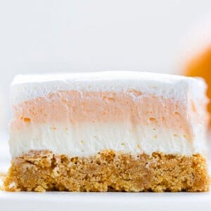 One Piece of Orange Creamsicle Bars on a White Plate