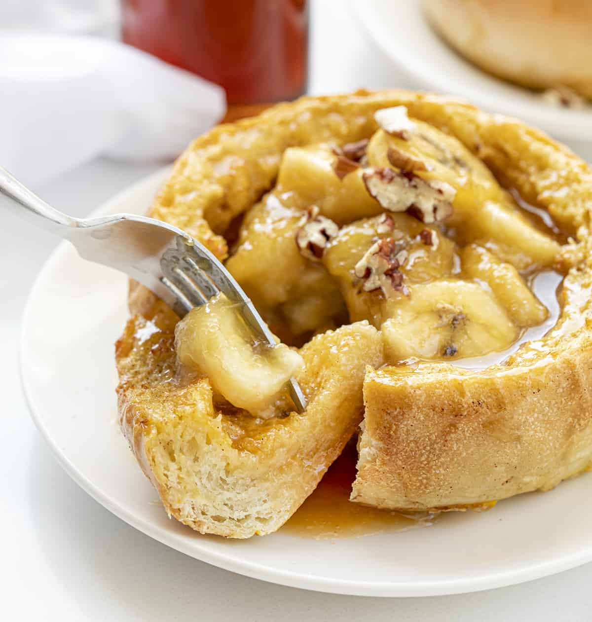 Fork Taking a Bite out of Bananas Foster French Toast Bowl. Breakfast, Breakfast Bowl, French Toast, French Toast Bread Bowl, Bananas Foster French Toast Bread Bowl, Air Fryer Breakfast, Breakfast Recipes, Brunch Recipes, Easy Bananas Foster, French Toast Bowls, i am baker, iambaker.