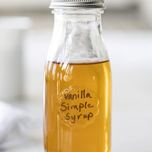 Bottle of Vanilla Simple Syrup on Counter. Simple Syrup, How to Make Simple Syrup, Vanilla Simple Syrup, How to Use Simple Syrup, Cocktail Syrup, drinks, beverages, recipes, iambaker, i am baker.