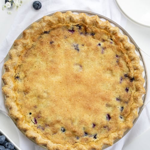 Overhead of a Baked Blueberry Buttermilk Pie. Dessert, Baking, Pie, Pie Crust, Best Pie Crust, Buttermilk Pie, Blueberry Pie, Christmas Dessert, Summer Dessert, Old Fashioned Dessert, i am baker, iambaker