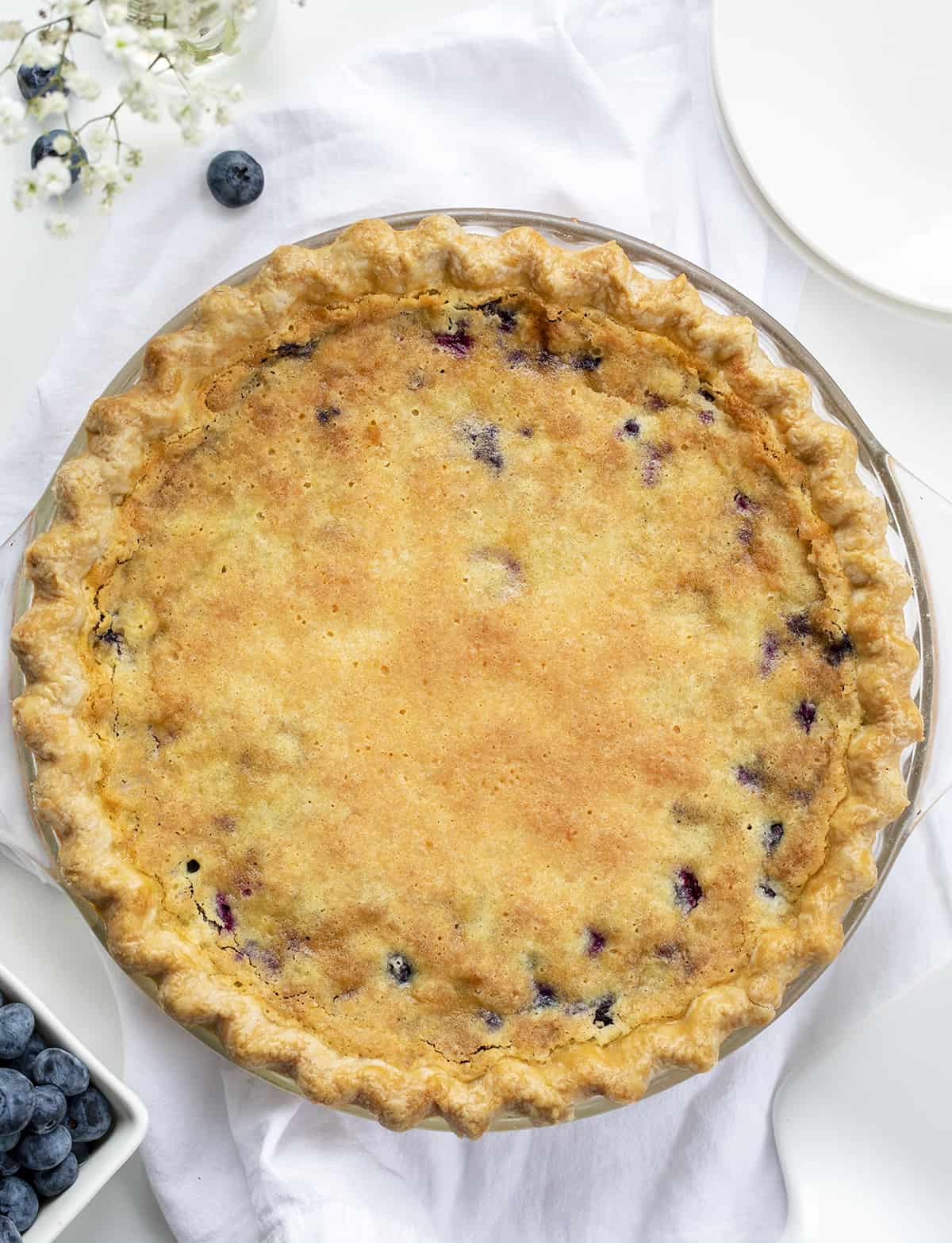 Overhead of a Baked Blueberry Buttermilk Pie. Dessert, Baking, Pie, Pie Crust, Best Pie Crust, Buttermilk Pie, Blueberry Pie, Christmas Dessert, Summer Dessert, Old Fashioned Dessert, i am baker, iambaker