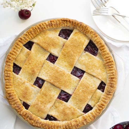 Overhead of a Cherry Pie with Lattice Crust. Cherry Pie, Homemade Pie, Real Homemade Cherry Pie, How to Make Cherry Pie Filling, Best Homemade Pie Crust, Old Fashioned Cherry Pie, The Best Cherry Pie, Baking, Dessert, Christmas Pie, Thanksgiving Pie, Easy Cherry Pie, i am baker, iambaker