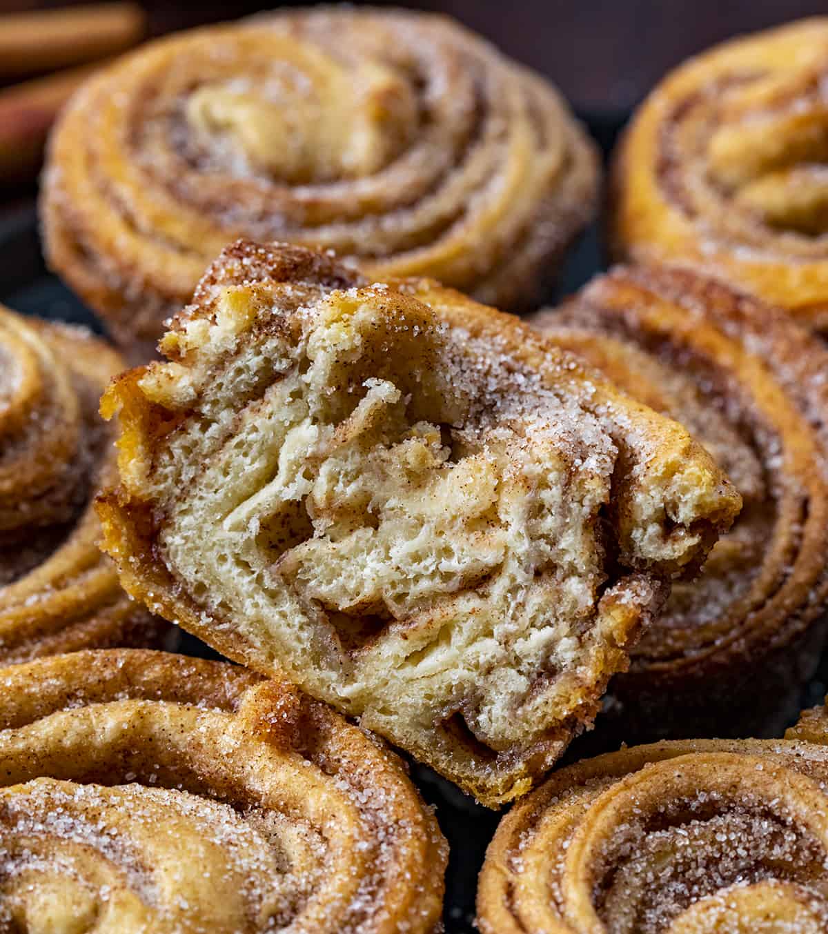 Cut into Cruffin Muffin on Top of Other Cruffins. Baking, Breakfast, Cruffins, Croissant Muffins, Easy Cruffins, Easy Cruffin Recipe, Fall Baking, Cinnamon Cruffins, Cinnamon Sugar Cruffins, Dessert, Breakfast Ideas, Brunch Recipes, i am baker, iambaker