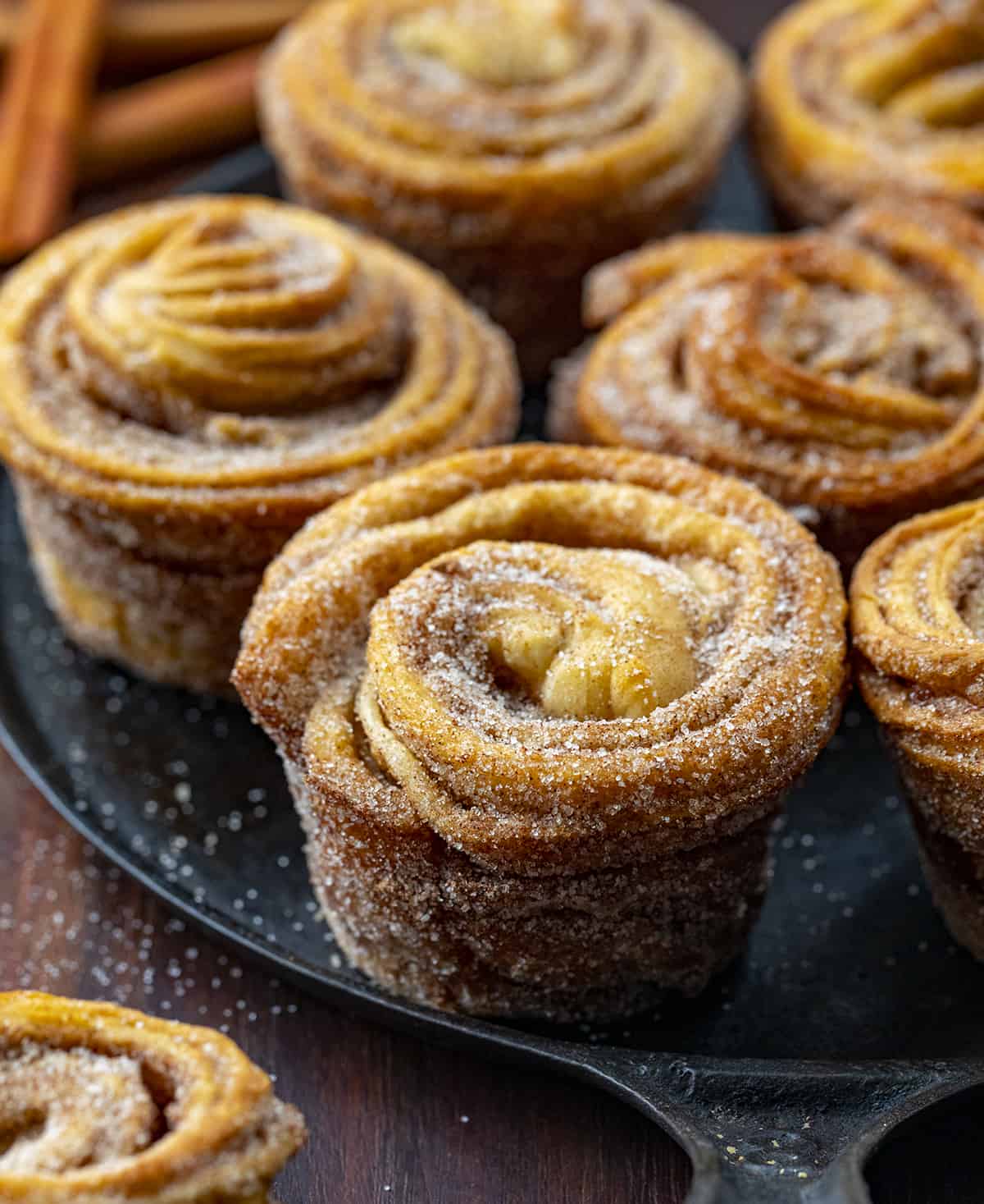 Close up of Cruffins on a Black Plate. Baking, Breakfast, Cruffins, Croissant Muffins, Easy Cruffins, Easy Cruffin Recipe, Fall Baking, Cinnamon Cruffins, Cinnamon Sugar Cruffins, Dessert, Breakfast Ideas, Brunch Recipes, i am baker, iambaker