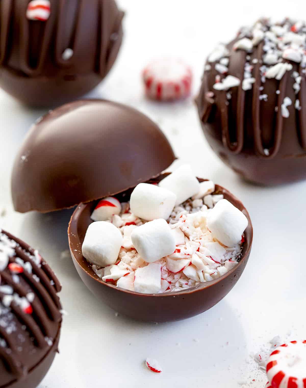A Peppermint Cocoa Bomb with the Filling Before it is Sealed Closed with Chocolate.