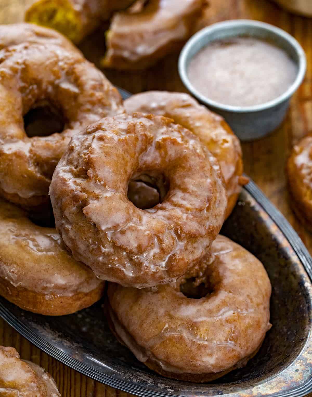 Try of Glazed Pumpkin Donuts on Cutting Board. Breakfast, Donuts, Donut Recipes, Pumpkin Donut Recipes, How to Fry Donuts, Pumpkin Donuts in the Air Fryer, How to Bake Donuts, Baked Pumpkin Donuts, Brunch Ideas, Fall Baking, Best Pumpkin Donuts, i am baker, iambaker