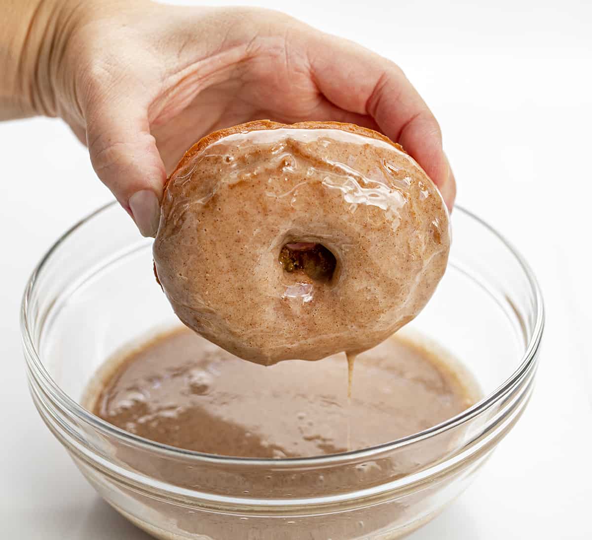 Dipping a Pumpkin Donut into Maple Cinnamon Glaze. Breakfast, Donuts, Donut Recipes, Pumpkin Donut Recipes, How to Fry Donuts, Pumpkin Donuts in the Air Fryer, How to Bake Donuts, Baked Pumpkin Donuts, Brunch Ideas, Fall Baking, Best Pumpkin Donuts, i am baker, iambaker