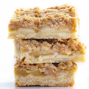 Stack of Apple Shortbread Bars on White Counter.