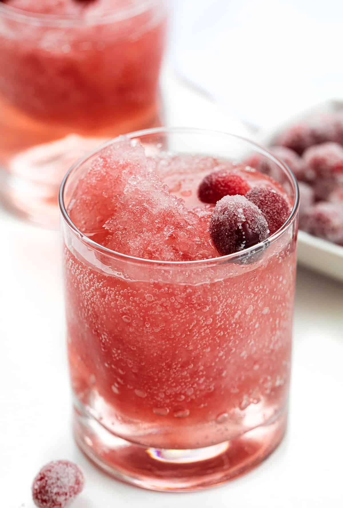 Glasses of Cranberry slush with Sugared Cranberries.