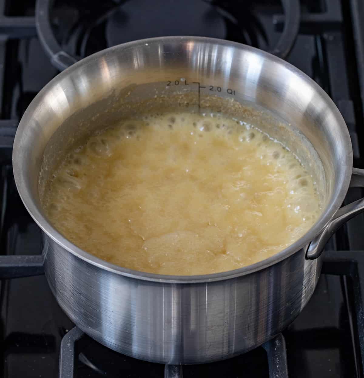 Pot of eggnog Fudge on the Stovetop with a Low Rolling Boil. 