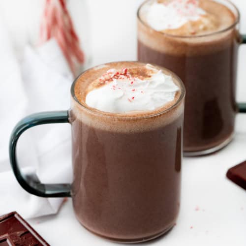 Glasses of Peppermint Hot Chocolate on a Counter.