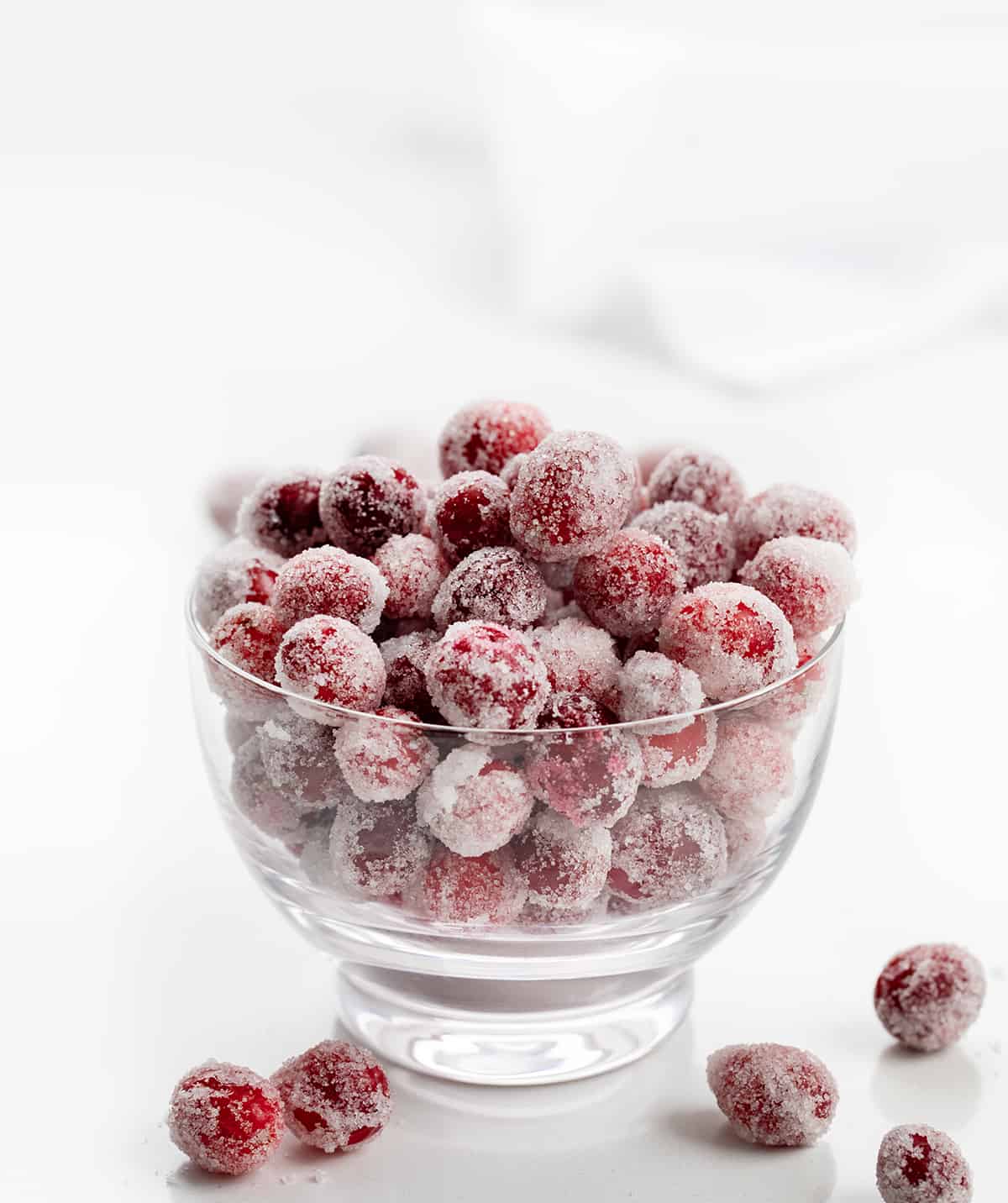 Bowl of Sugared Cranberries on a White Counter.
