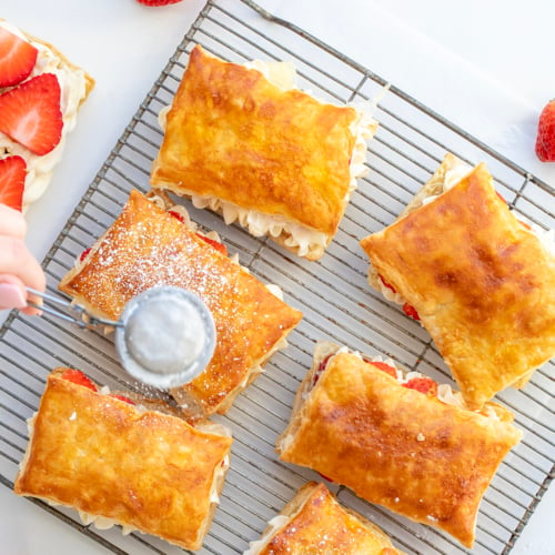 Dusting the Tops of Strawberry Napoleon with Confectioner's Sugar