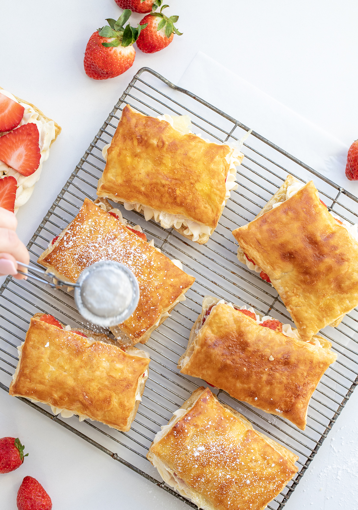 Dusting the Tops of Strawberry Napoleon with Confectioner's Sugar