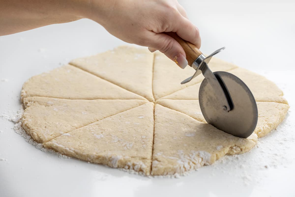 Using a Pizza Cutter to Divide up Sections of Sconut Donut.