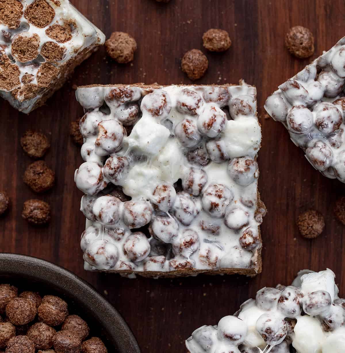 Cocoa Puff Bars on a Cutting Board with Cocoa puffs.