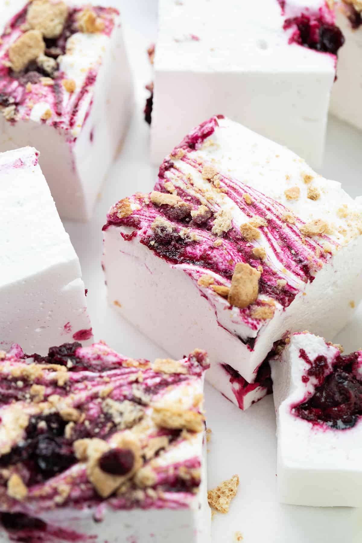 Pieces of Gourmet Blueberry Marshmallows On a White Surface and Cut into Squares.