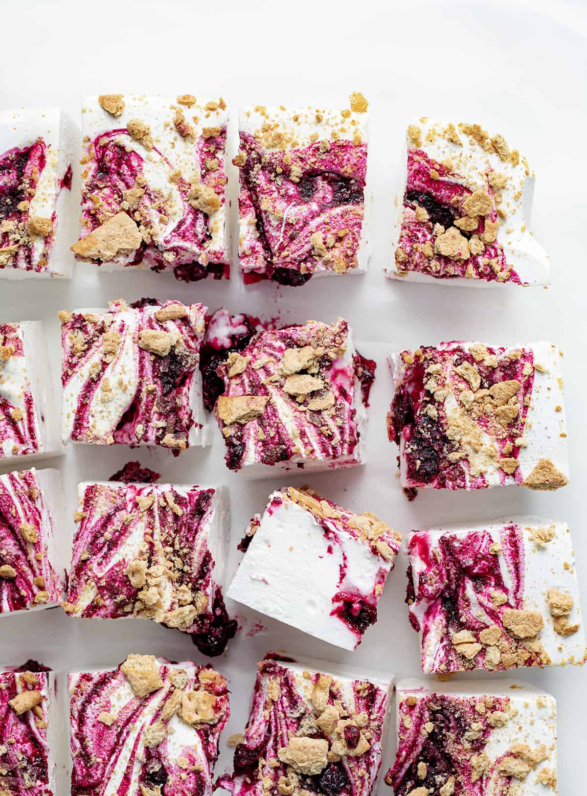 Pieces of Gourmet Blueberry Marshmallows On a White Surface and Cut into Squares.