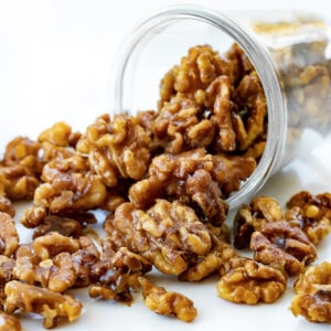 Jar of Candied Walnuts Tipped Over and Some Falling out Onto the Counter.