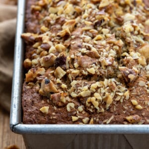 Close up of Brown Butter Banana Nut Bread in Pan on Butting Board.