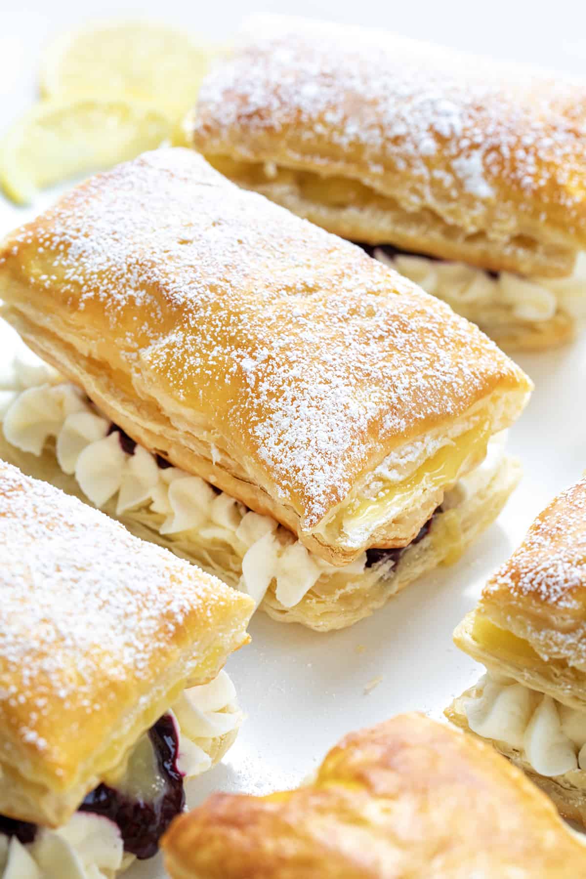 Close up of the Tops of Blueberry Lemon Napoleons Focusing on the Dusting of Powdered Sugar.