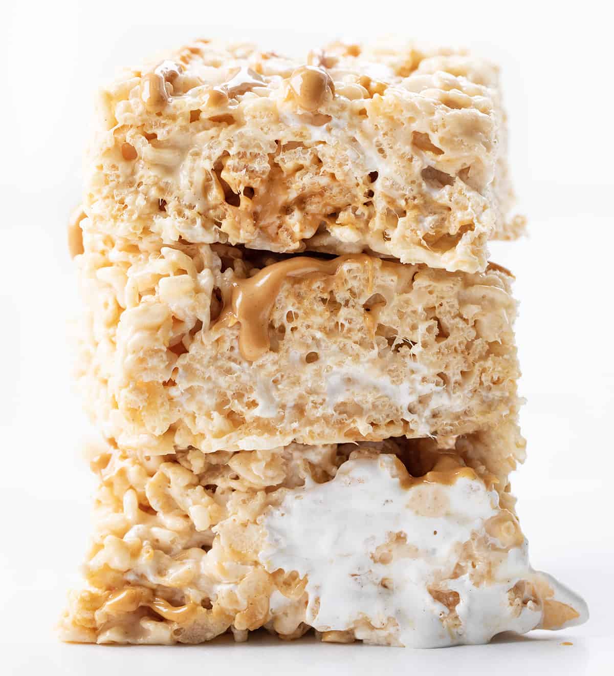 Stack of Fluffernutter Rice Krispie Bars on a White Counter.